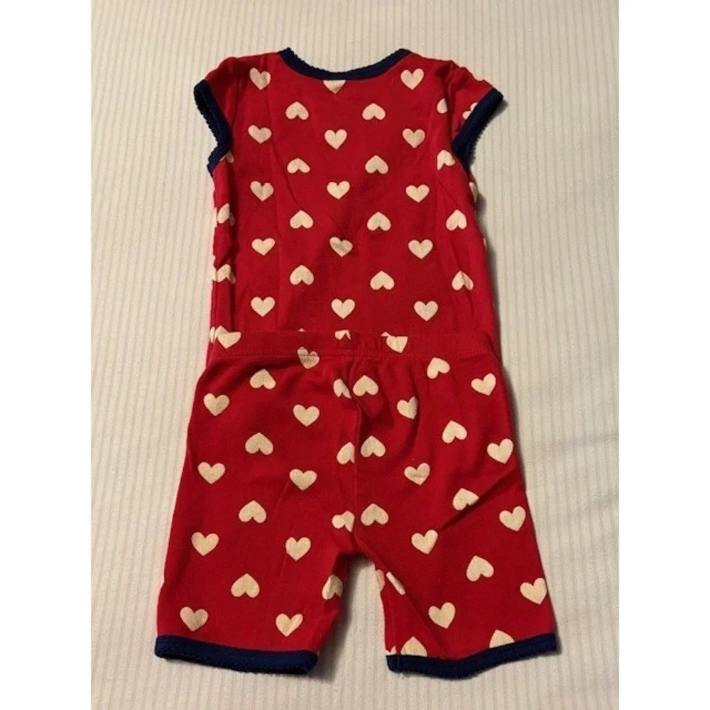 Carters size 2T 2 piece pajama set, red with white hearts and blue border